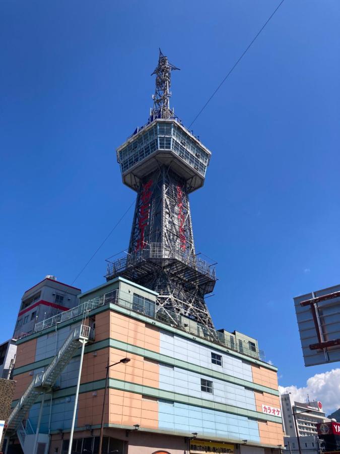 J-Hoppers Beppu Guesthouse ジェイホッパーズ別府ゲストハウス Bagian luar foto